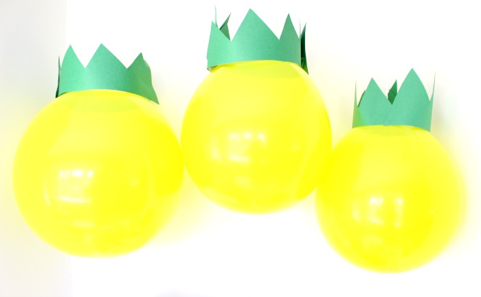 Pineapple decoration with a yellow balloon and green paper