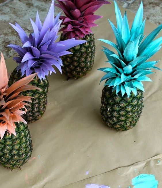 Pineapples with different color painted stems