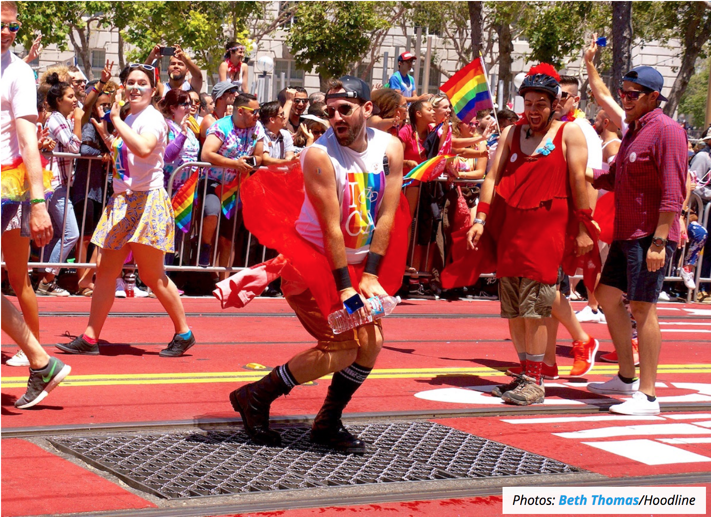 People dancing in colorful apparel at SF Pride celebration