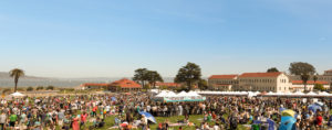 Presidio park filled with people standing and sitting and tents for Off the Grid: Presidio Picnic