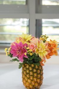 Pineapple with flowers in it