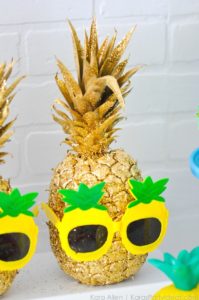Pineapple spray painted gold with gold glitter and pineapple sunglasses
