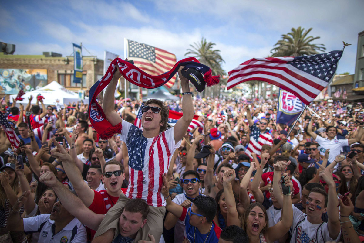 Fans cheer after the U.S. scored a second goal during the 2014 Brazil World Cup Group G soccer match between Ghana and the U.S. at a viewing party in Hermosa Beach